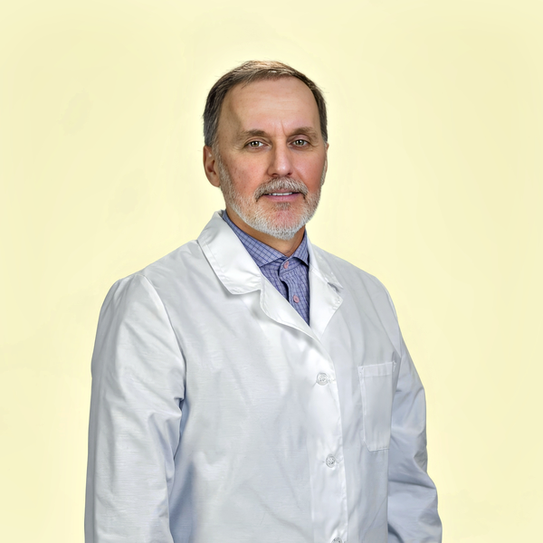 Medical headshot example: Physician with white coat, real photo enhanced by AI