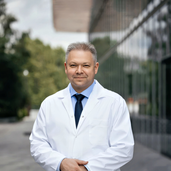 Medical headshot example: Physician with white coat, real photo enhanced by AI