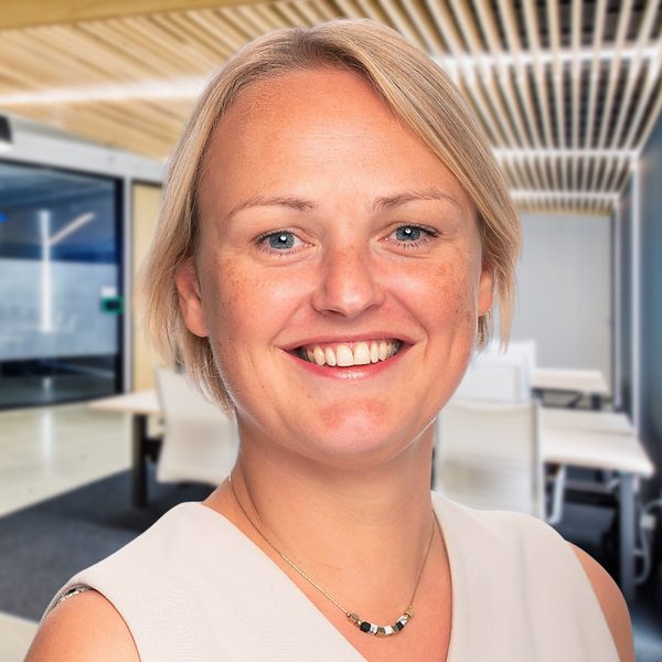 Corporate headshot example, real photo enhanced by AI