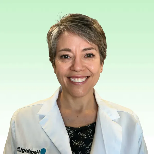 Corporate headshot example, real photo enhanced by AI