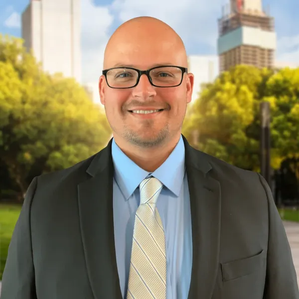 Corporate headshot example, real photo enhanced by AI