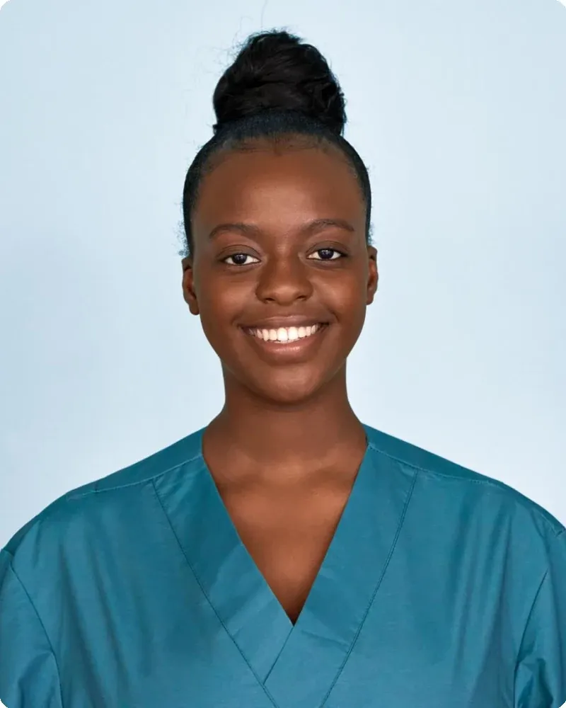 Clean scrubs in solid color. Solid colors photograph far better than patterns at small directory sizes.