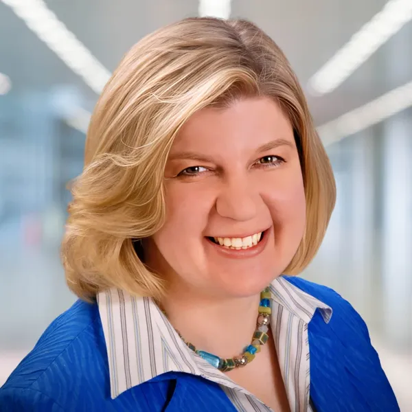 Corporate headshot example, real photo enhanced by AI