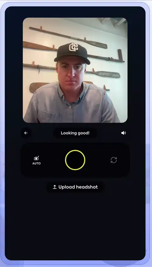 Animated clip of one Studio 2 session continuing after a failed lighting check: the person taps retake, changes hat, follows the on-screen framing hints, the shutter fires automatically, and the app returns 'You look great!' on the shot that passed.