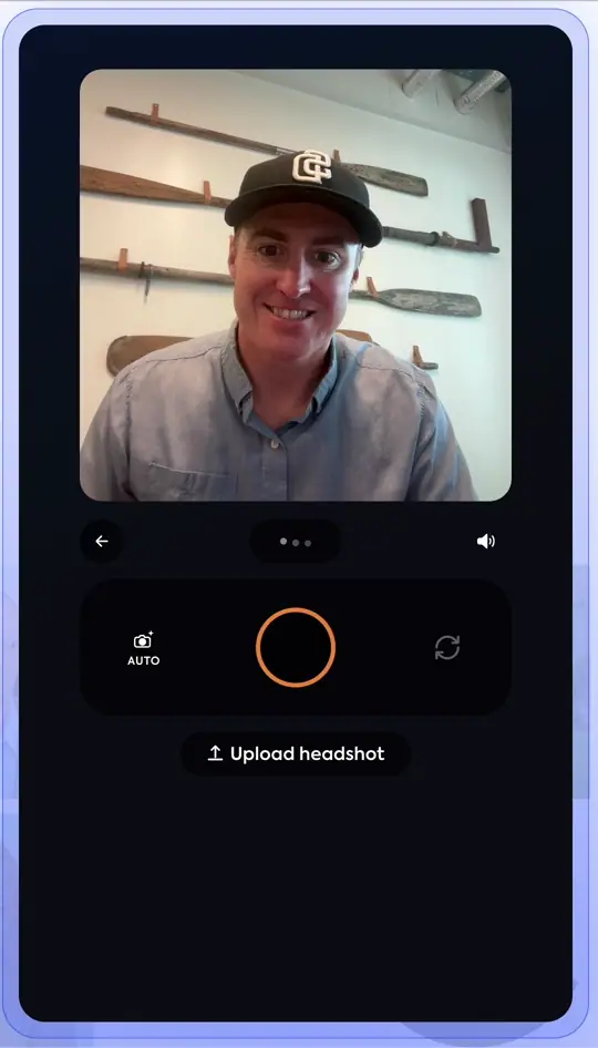 Animated clip of the Studio 2 capture screen guiding a person into frame: the on-screen hints update live as they adjust, then the capture ring arms and the shutter fires automatically.