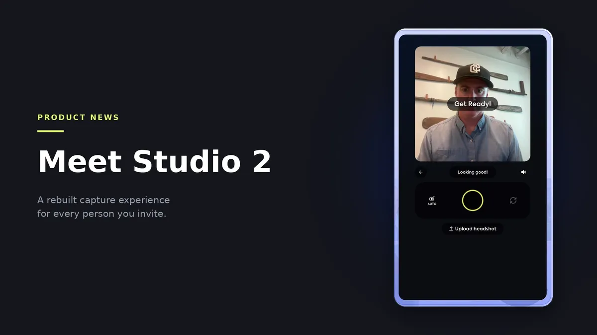Hero image for the Studio 2 launch announcement: on a dark Studio 2 surface, the headline 'Meet Studio 2' with the eyebrow 'Product News' and the line 'A rebuilt capture experience for every person you invite.', beside a phone screenshot of the Studio 2 capture screen showing the live camera view with the subject framed and the 'Get ready' prompt before the shutter fires.