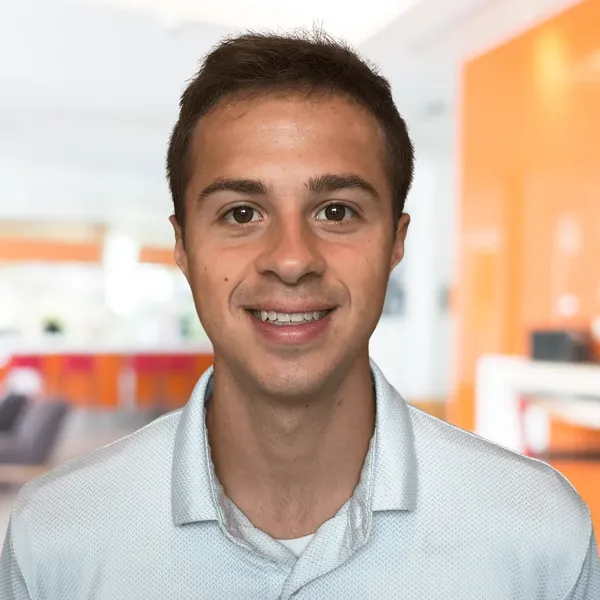 Corporate headshot example, real photo enhanced by AI
