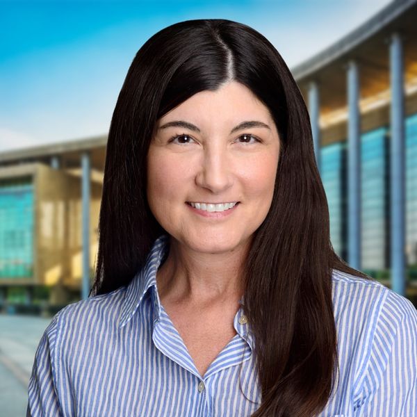 Corporate headshot example, real photo enhanced by AI