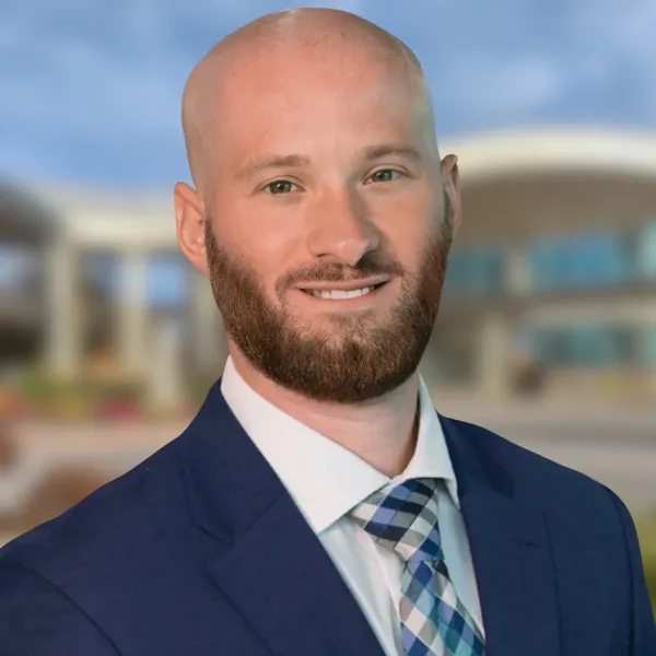 Corporate headshot example: placement mockup, real photo enhanced by AI