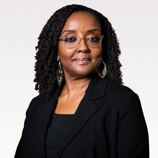 Corporate headshot example, real photo enhanced by AI