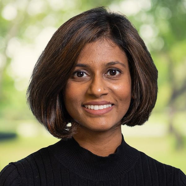 Corporate headshot example, real photo enhanced by AI