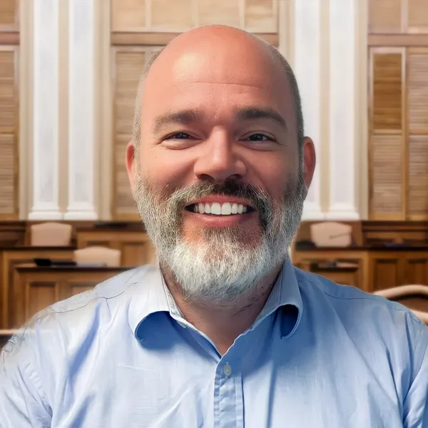 Lawyer headshot example #14, real photo enhanced by AI