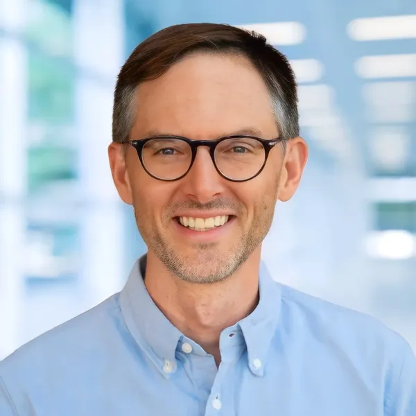 Corporate headshot example #2, real photo enhanced by AI