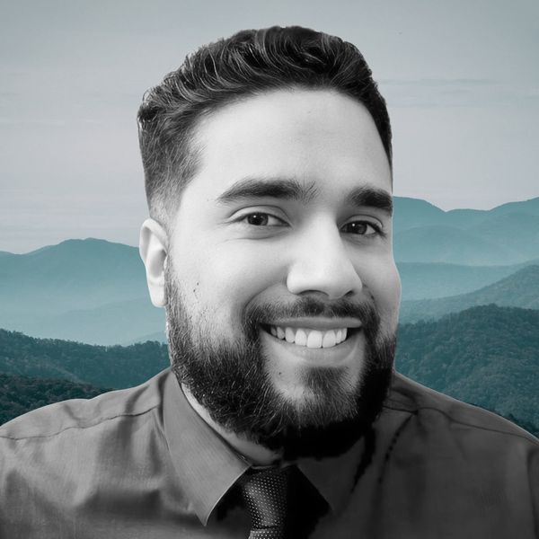 Corporate headshot example, real photo enhanced by AI