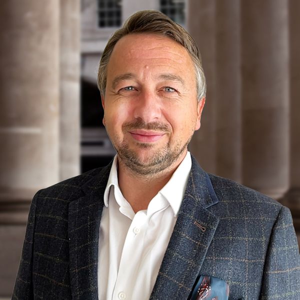 Corporate headshot example, real photo enhanced by AI