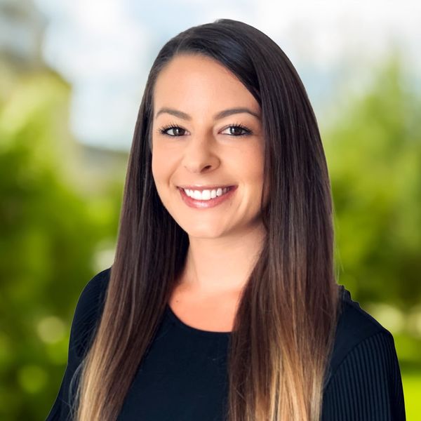 Corporate headshot example, real photo enhanced by AI