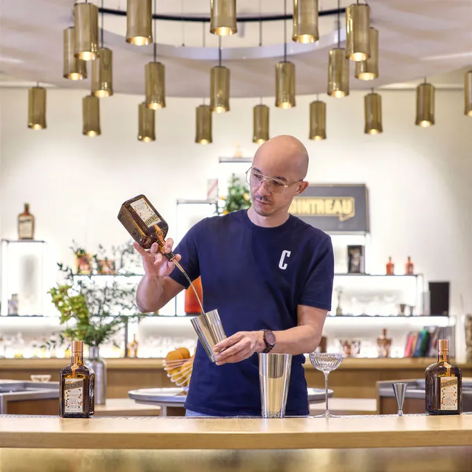 Barkeeper mixing a drink at le Carré, Angers