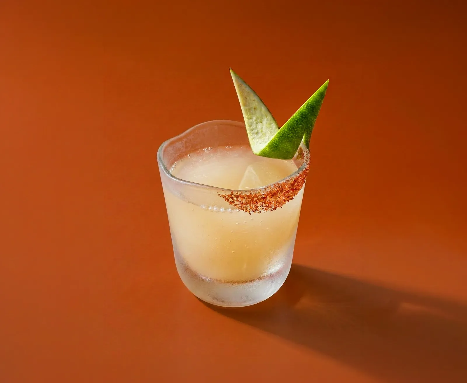 A Spicy Frozen Shot on an orange background