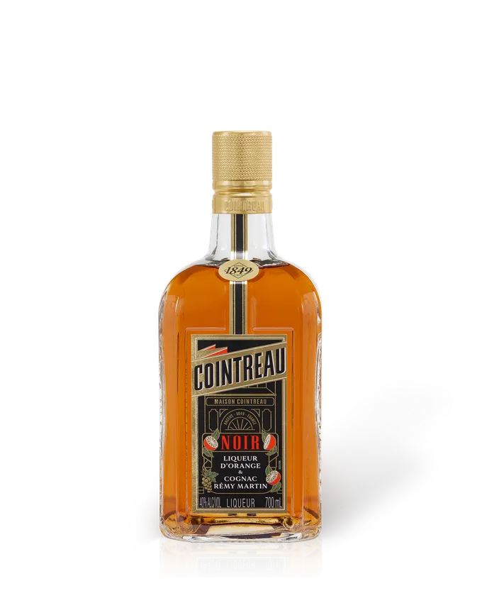 Cointreau Noir orange liqueur bottle, amber glass with golden cap and white label, 700 ml product shot on white background.