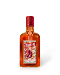 A bottle of Cointreau Spicy on a white background