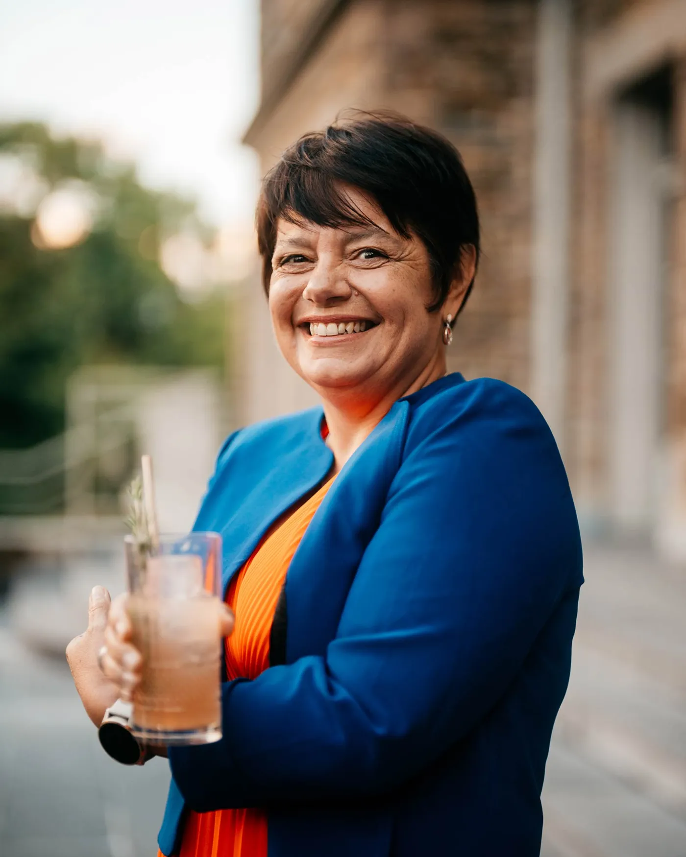 Medium shot of Master distiller Carole Quinton in front of a blurry background with bokeh