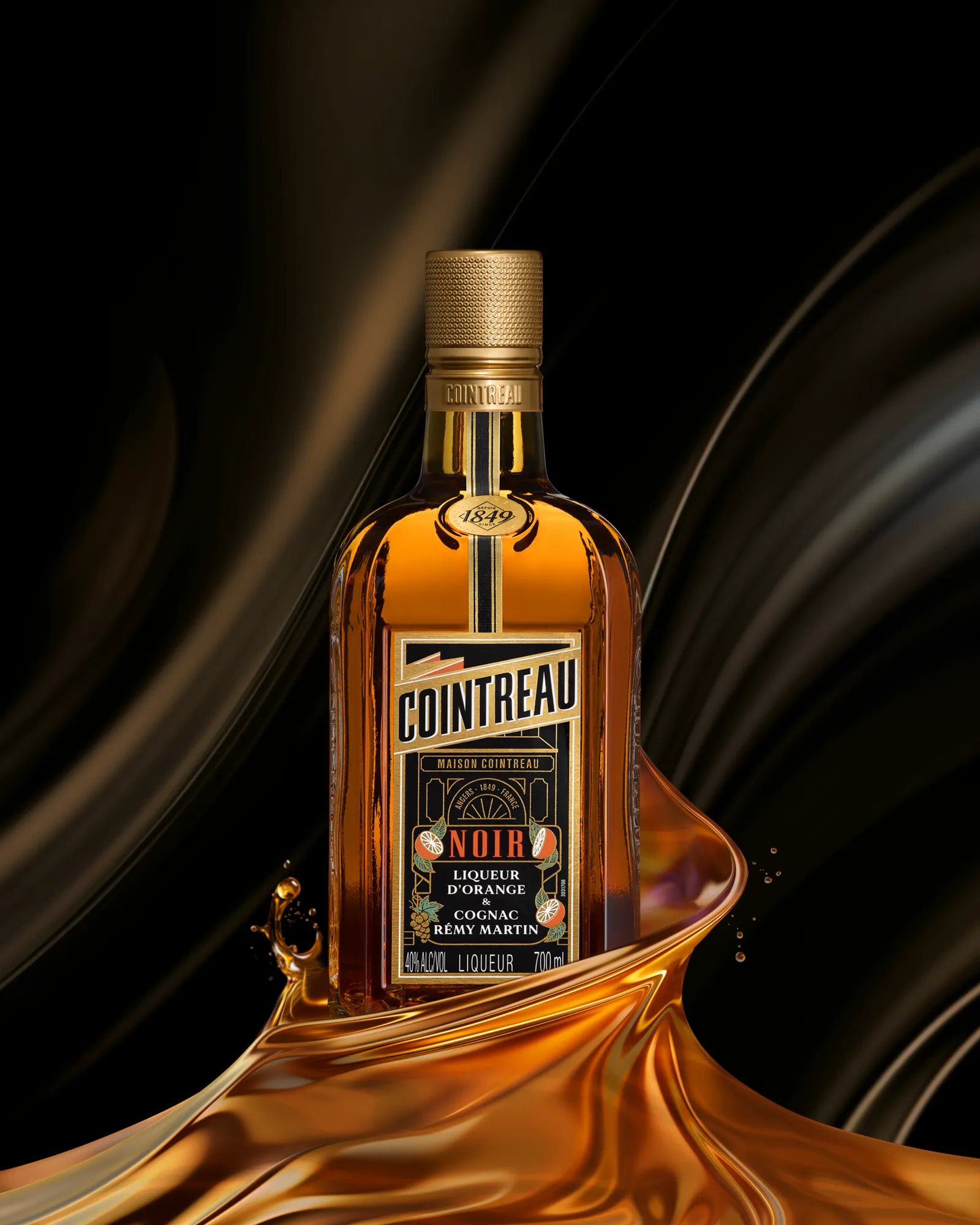 Cointreau Noir orange liqueur bottle with flowing liquid splash on dark, elegant background
