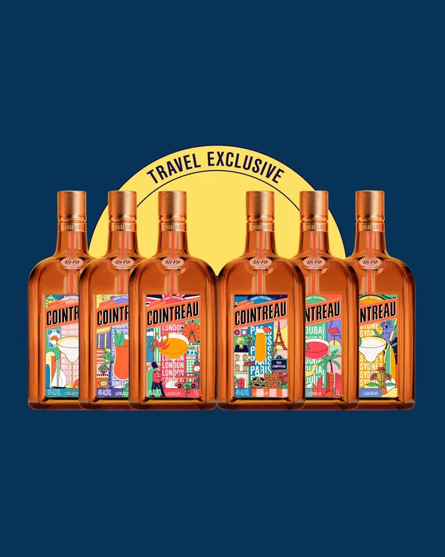 6 colorful decorated bottles of Cointreau’s Key Cities Limited Edition in front of a dark blue background