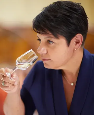 Cointreau Master Distiller Carole Quinton nosing a distillation in a tasting glass