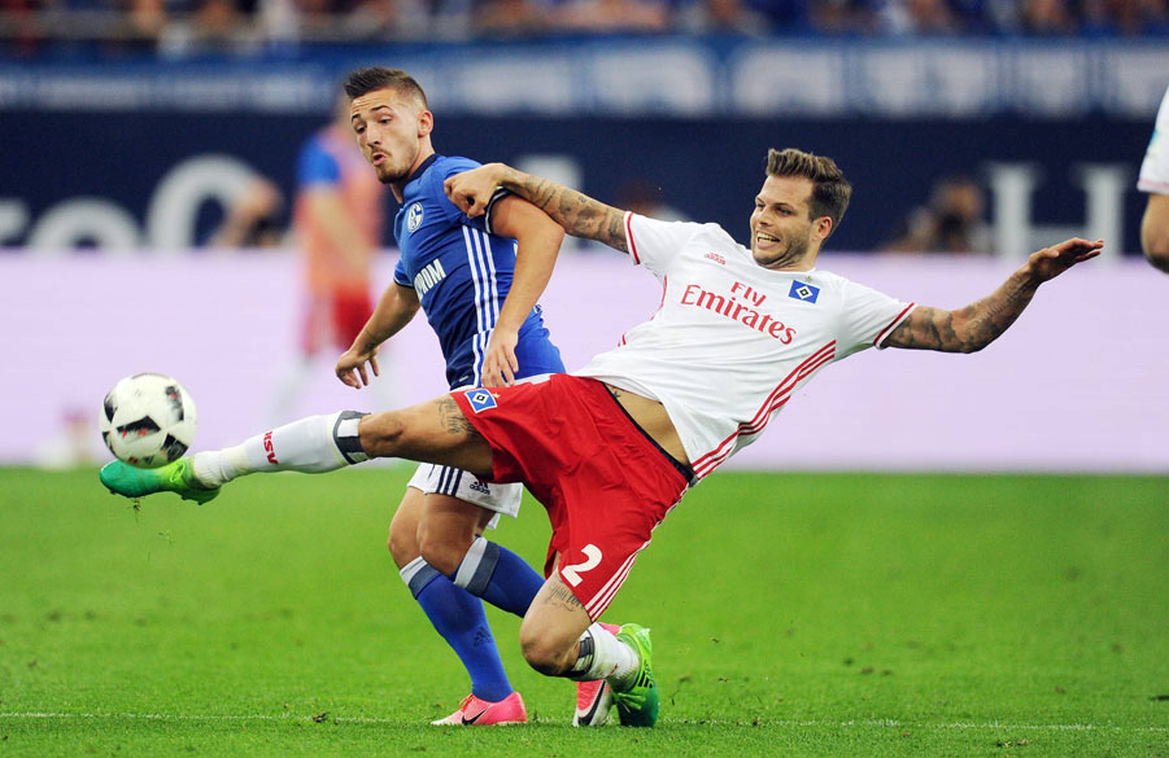 Dennis Diekmeier challenging at Schalke.