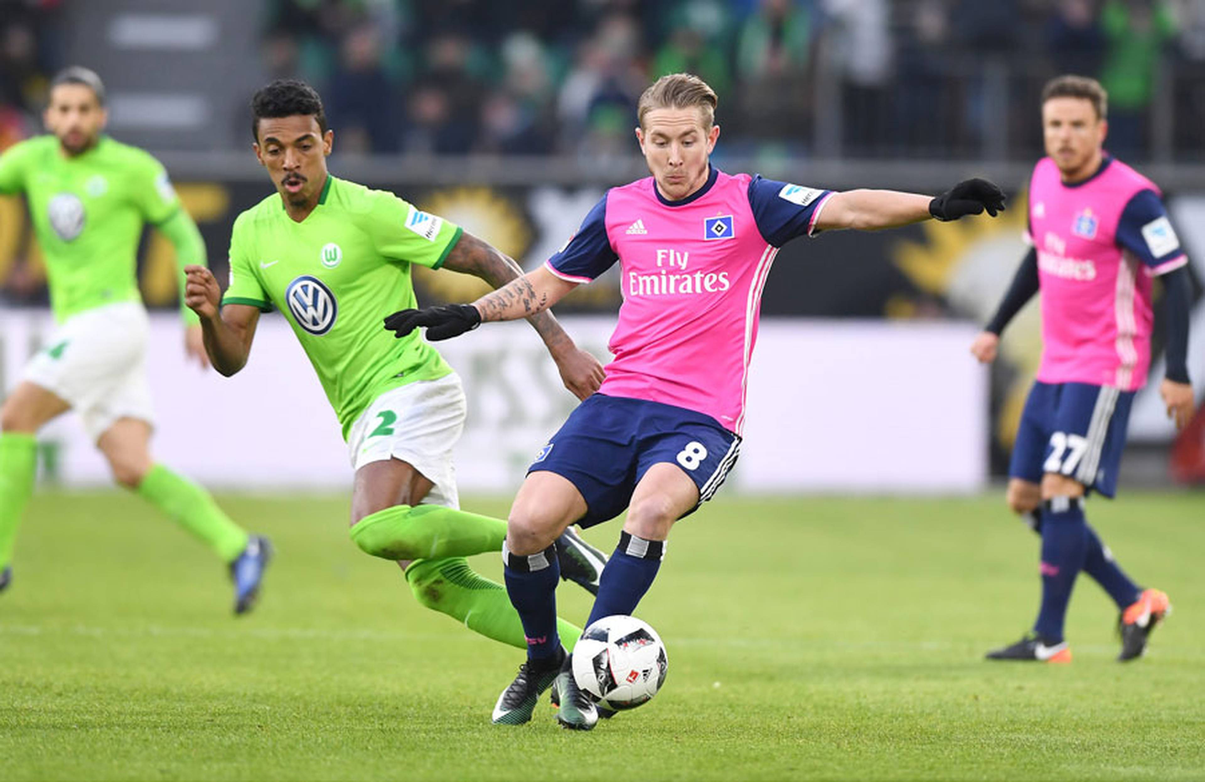 Lewis Holtby challenging.