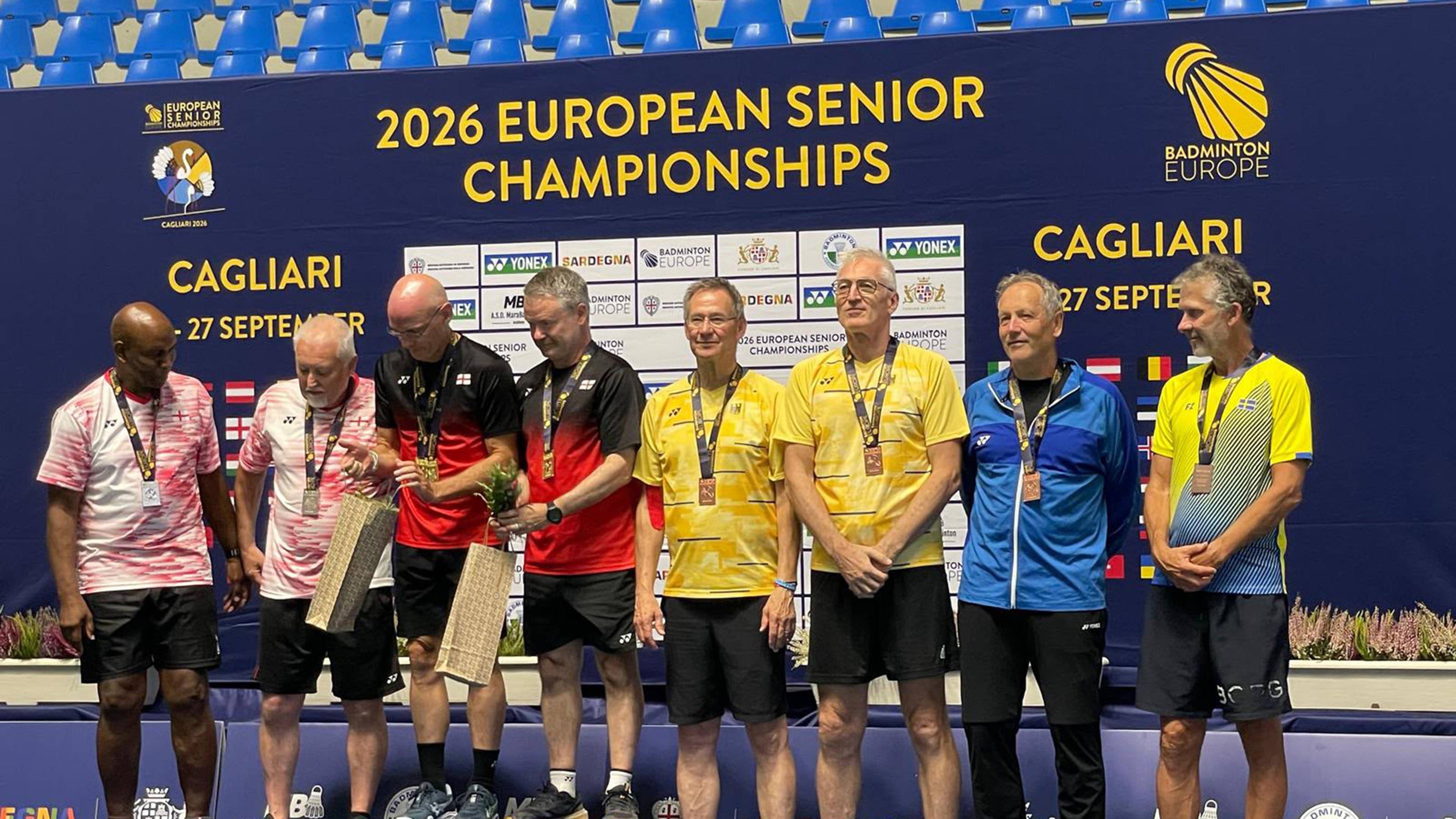 Group of senior athletes standing on a podium with medals at the 2026 European Senior Championships in Cagliari.