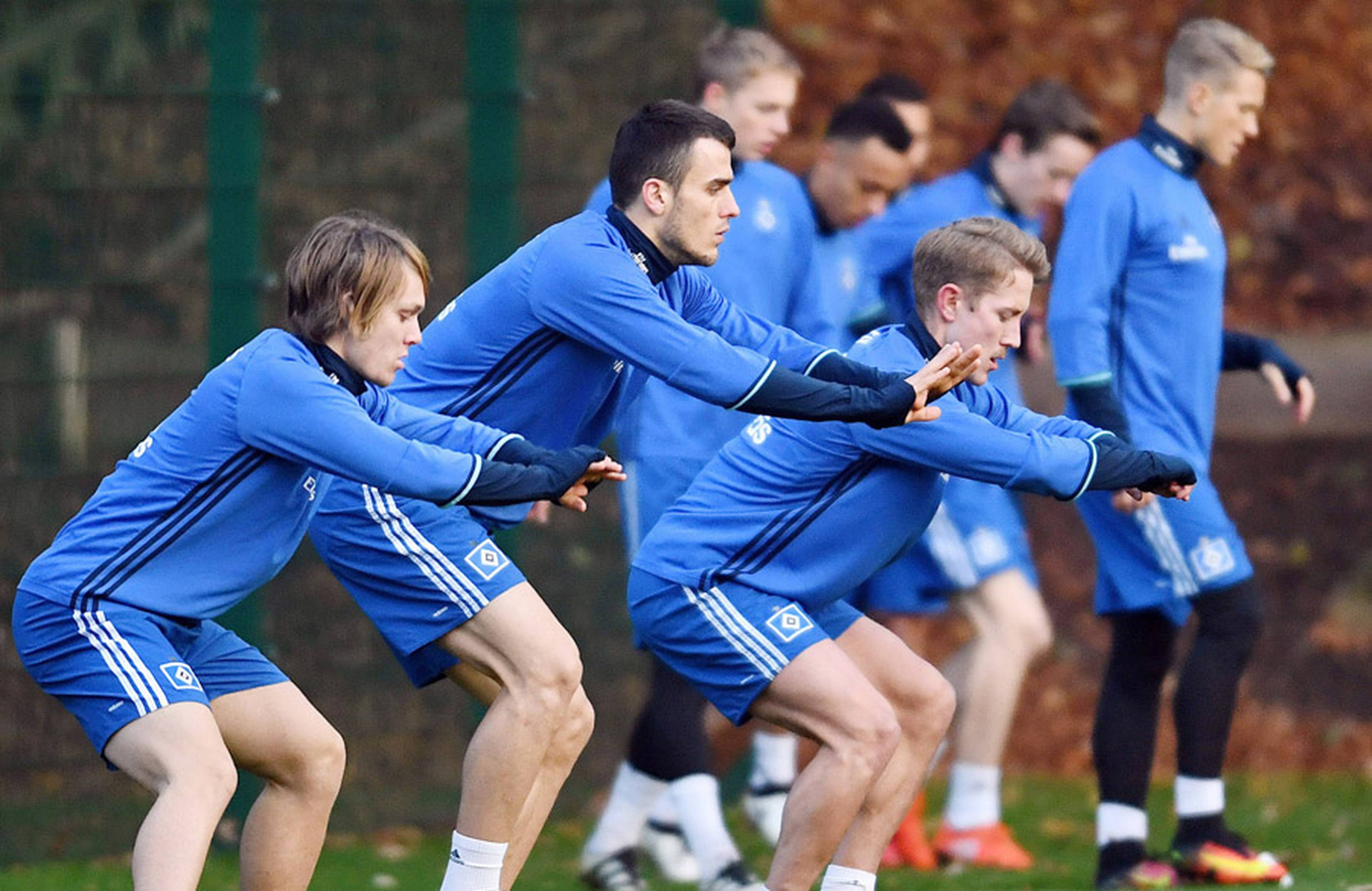 The team practising stability on the pitch.