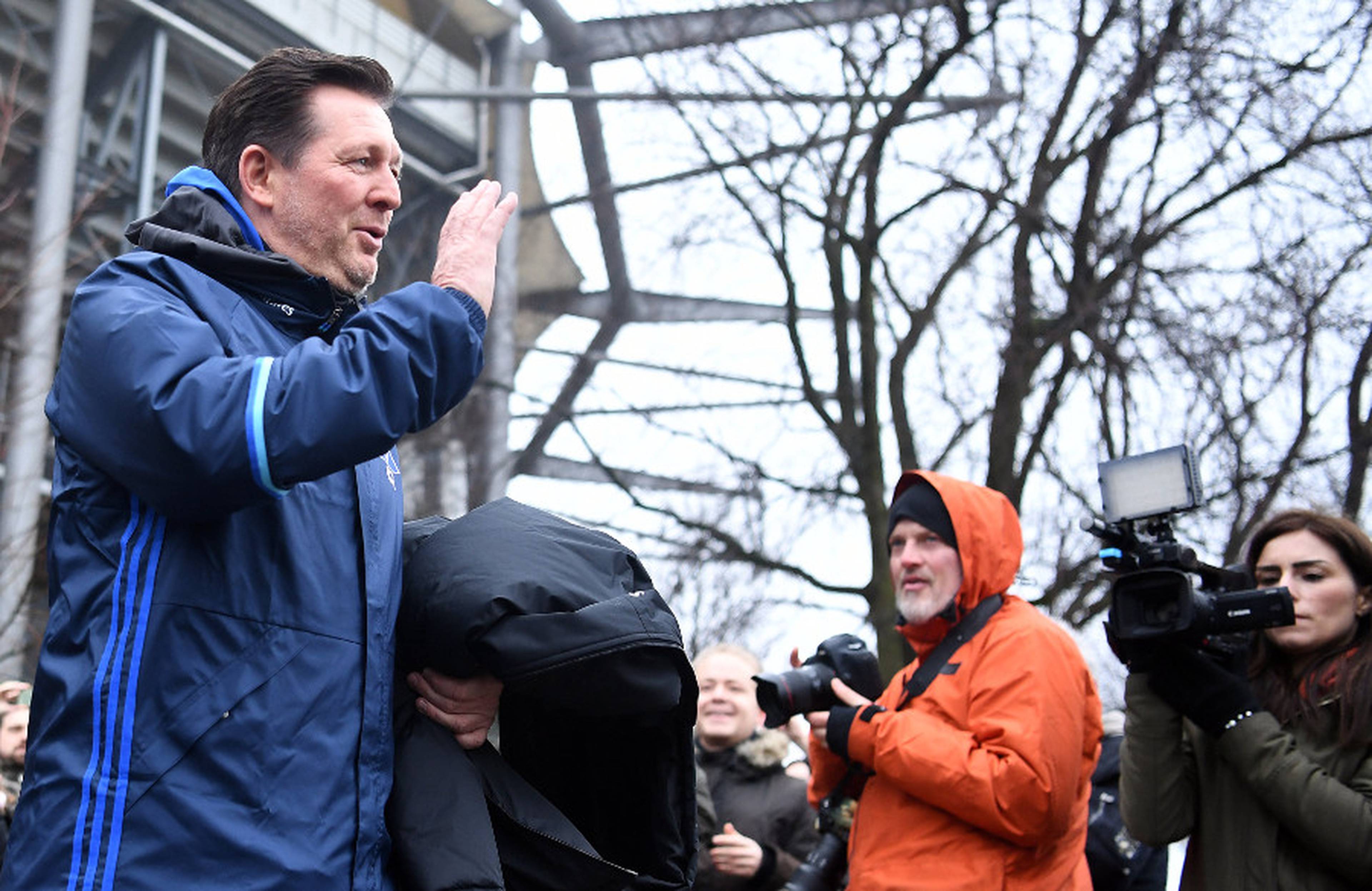 Caption: Christian Titz was greeted to cheers from the fans.