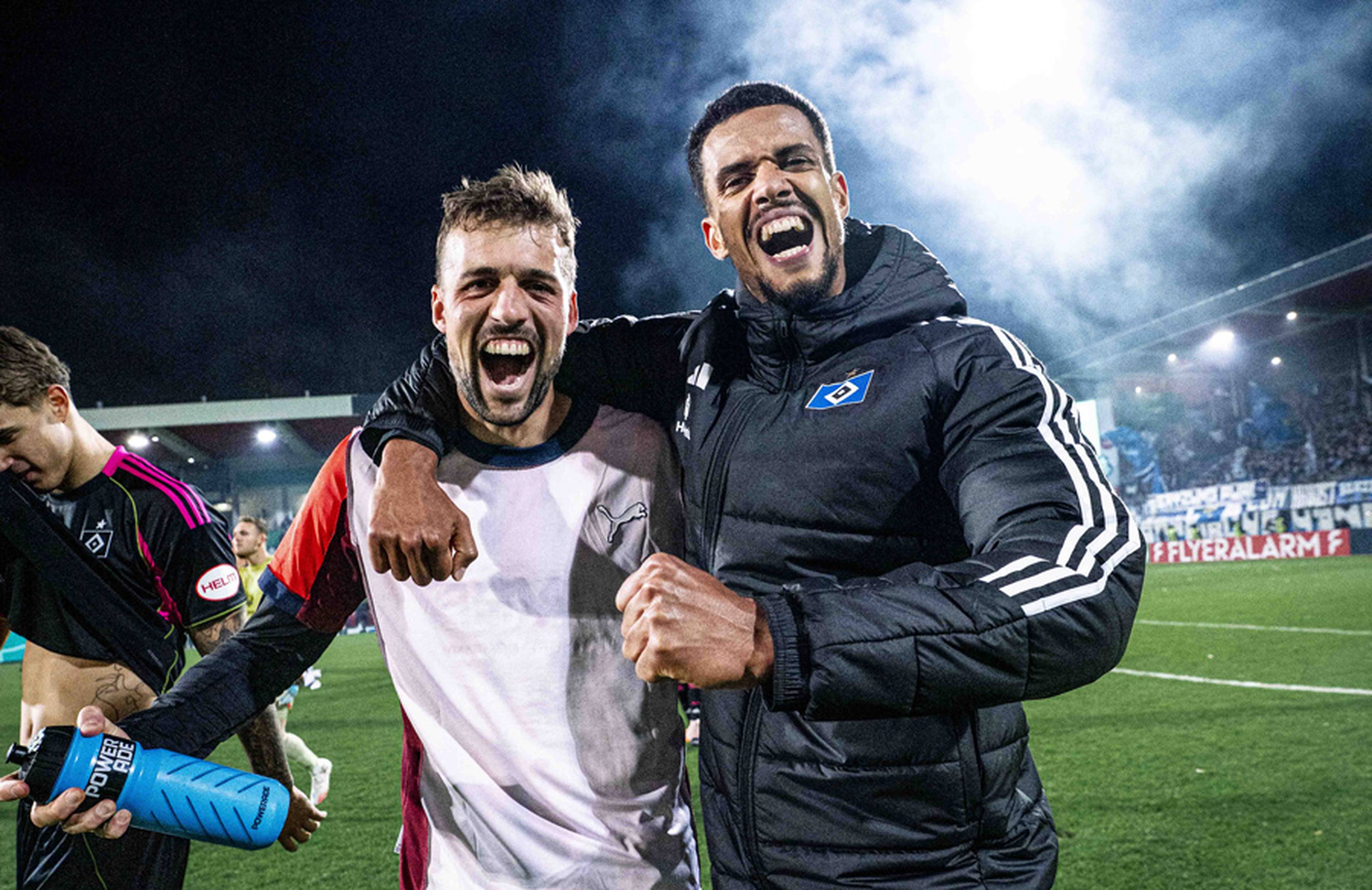 Jonas Meffert and Robert Glatzel celebrate together after the 1-0 win in Heidenheim. 