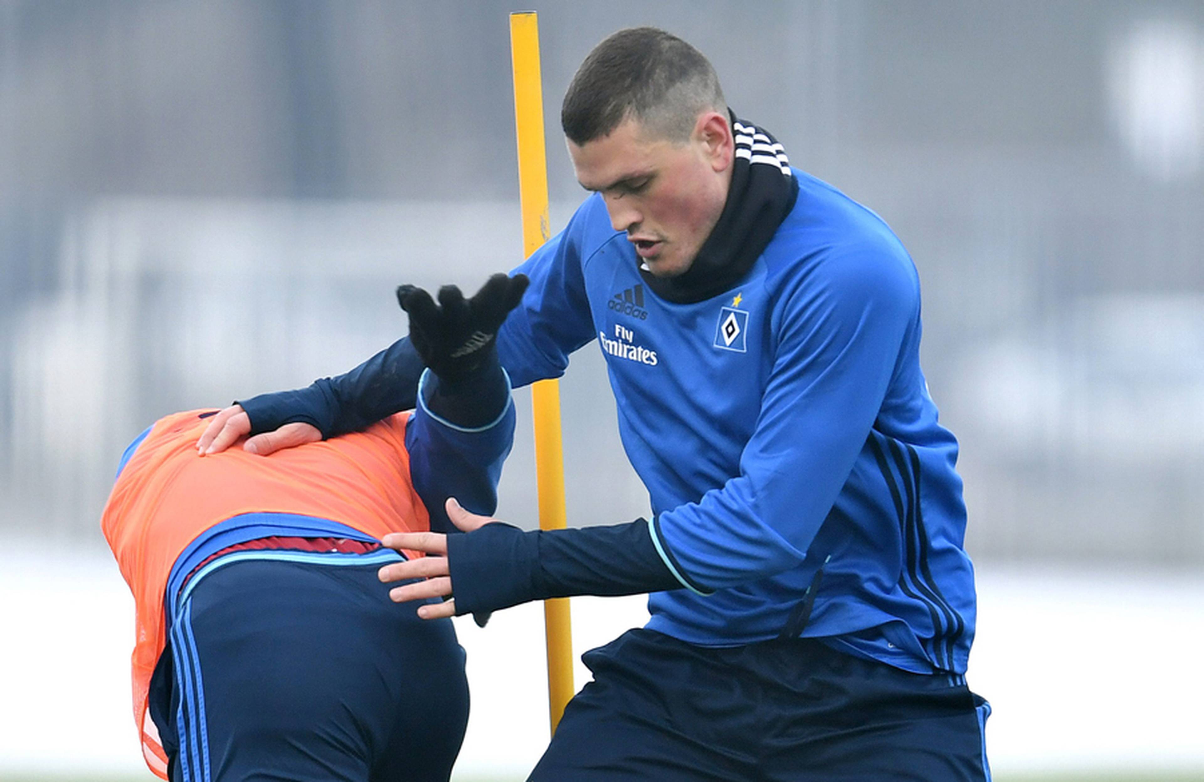 New signing Papadopoulos battles Djourou.