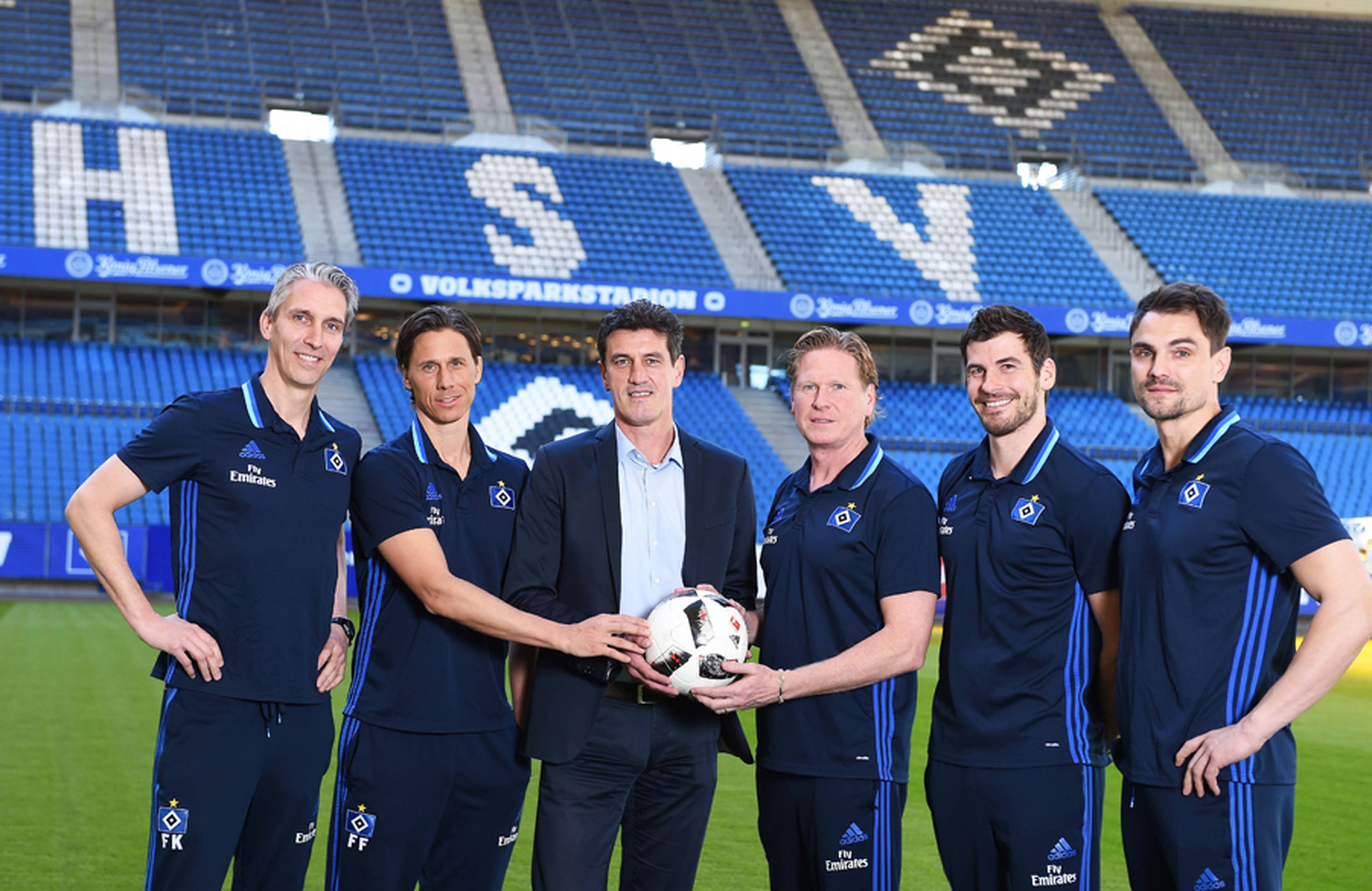 Co-trainers Frank Kaspari and Fröhling, sport boss Jens Todt, head coach Markus Gisdol, fitness coach Daniel Müssig and keeper coach Stefan Wächter (l.t r.) are delighted to continue with the Rothosen.