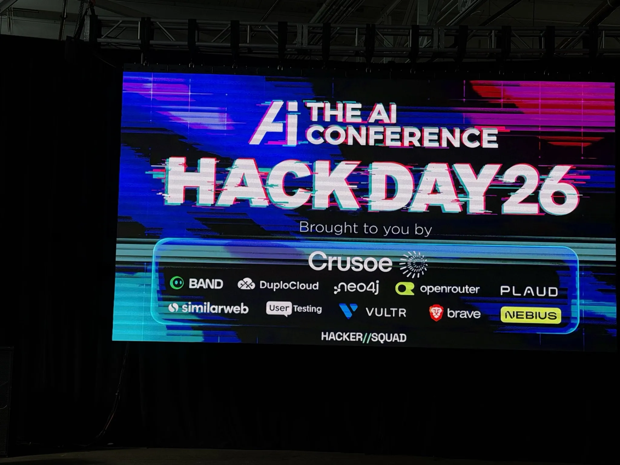 The stage screen at The AI Conference Hack Day 2026