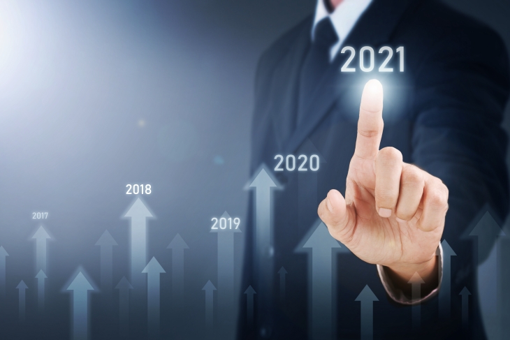 Man Standing And Pointing Hand With Arrow And Line Visual Graphic On Light Of Len Flare And Boke Blue Background. Copy Space. Business Concept : Market Uptrend 2021.