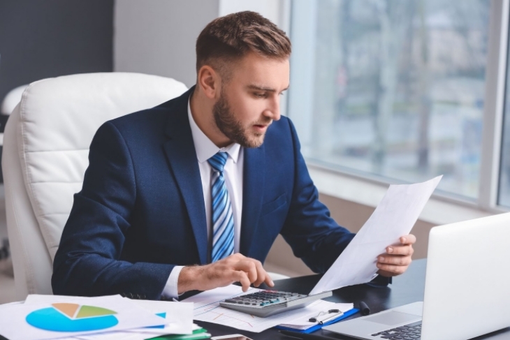 Man Reading A Document