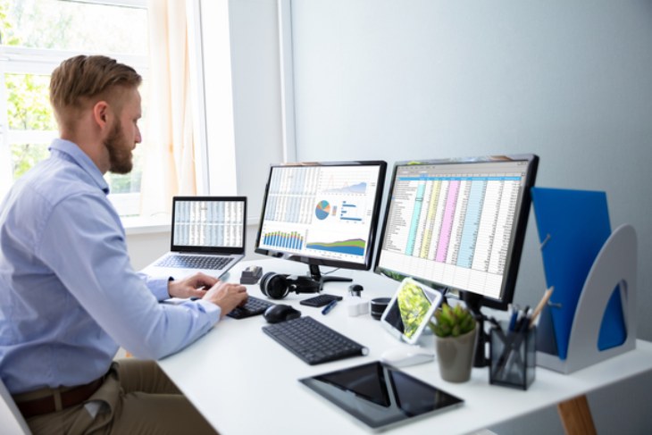 Businessman Working With Spreadsheet