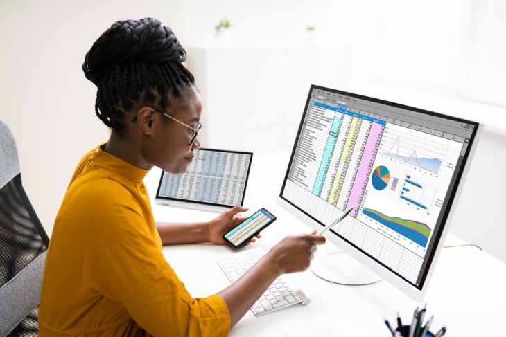 Woman Studying Charts And Graphs