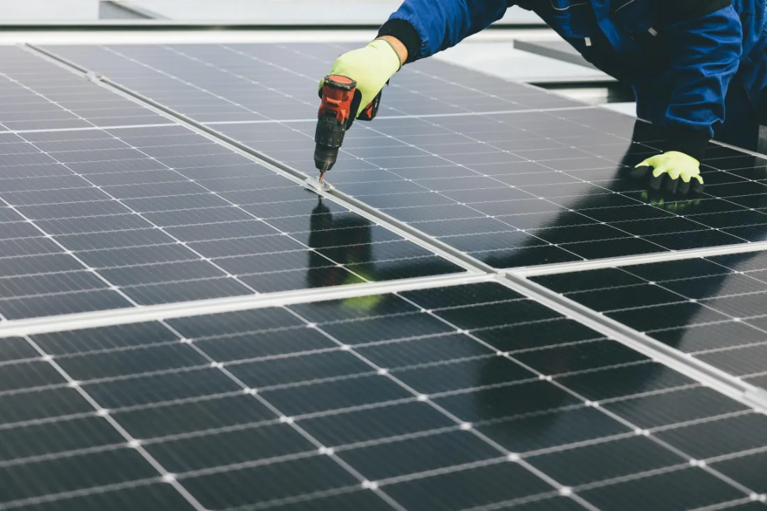 solar panel installation with drill