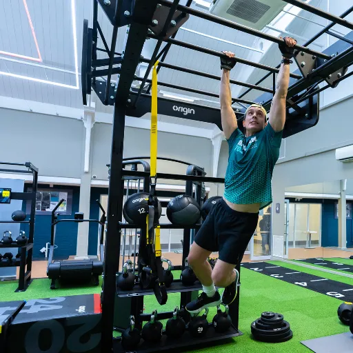 Man on training rig in the gym at Camberwell