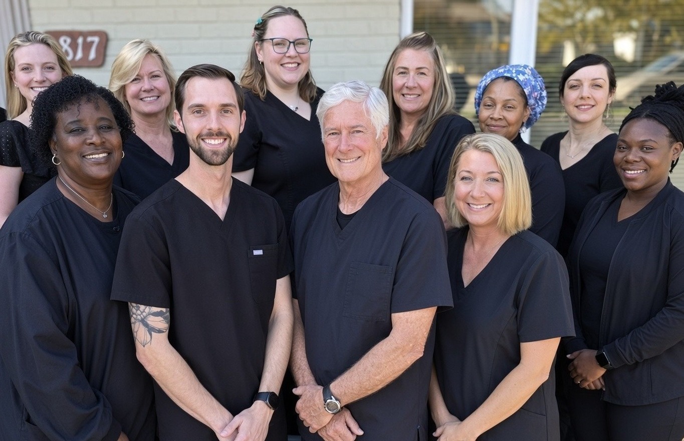 Dental team smiling together
