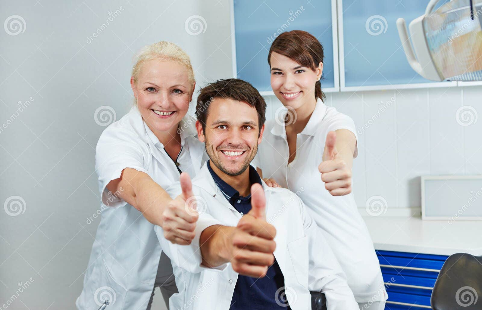 Dental team smiling together