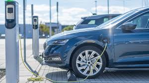 Electric company cars charging at employees' homes overnight, illustrating the fleet electrification business case