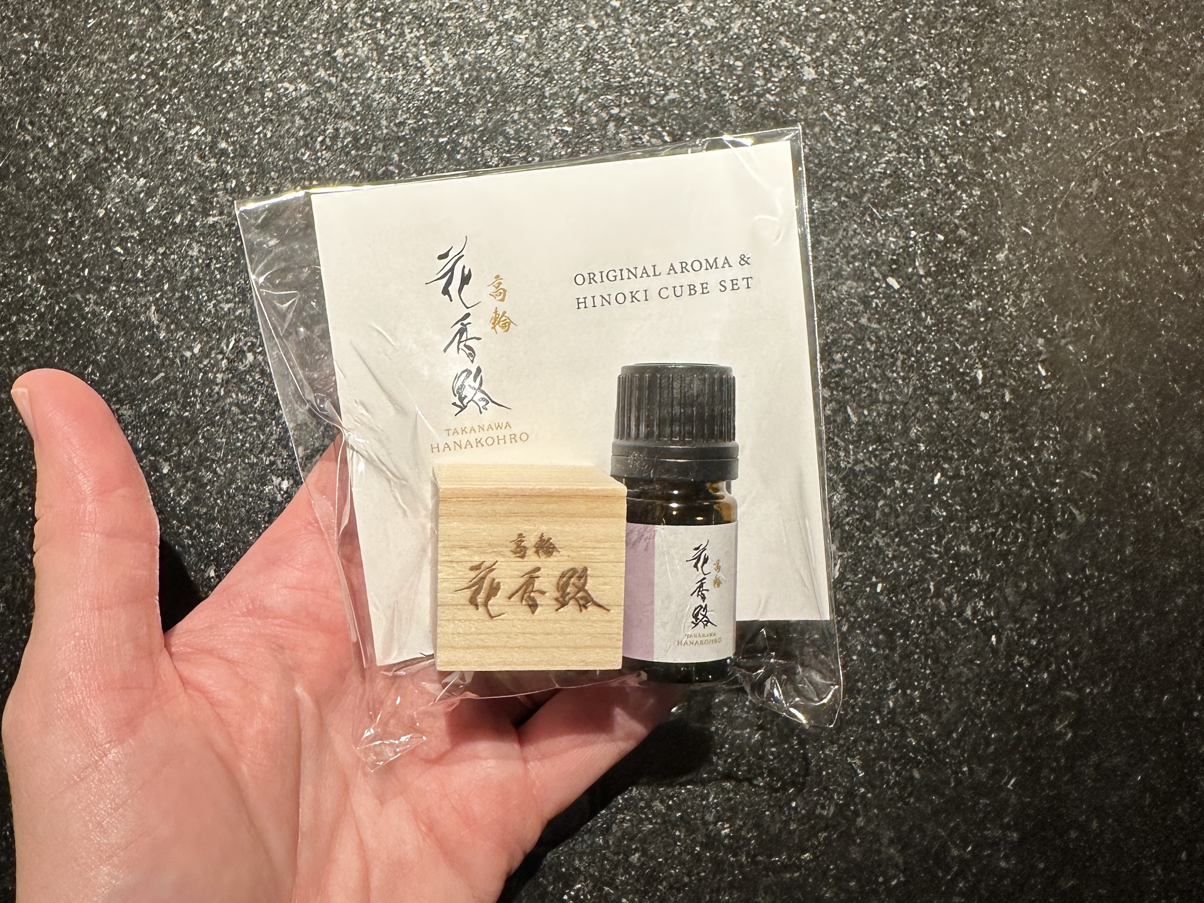 A Takanawa Hanakohro hinoki diffuser cube and hinoki essential oil checkout gift.