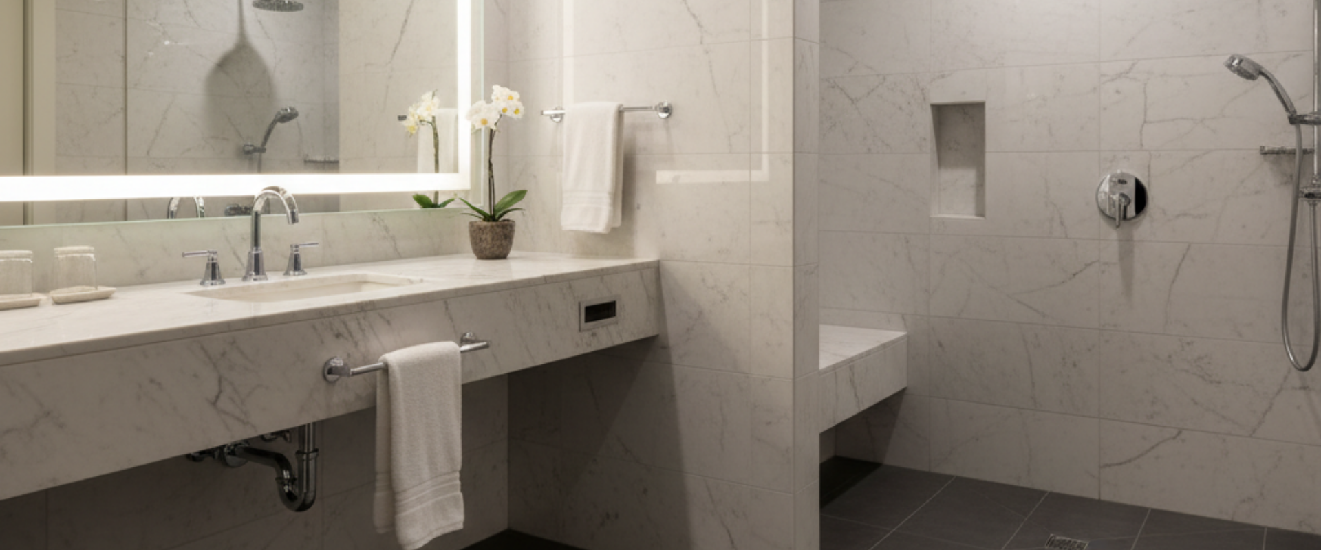 Elegant cultured marble vanity top in a hotel bathroom, highlighting durability and modern design for B2B buyers.