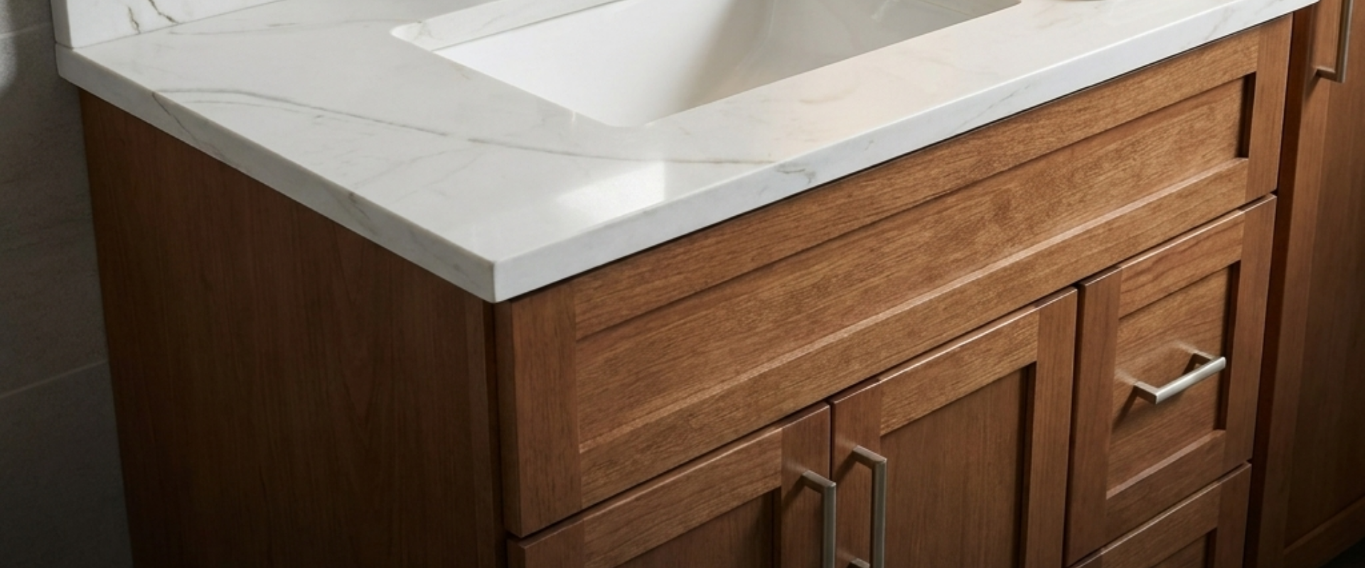 Cultured marble shower surrounds and vanity tops in a modern multifamily bathroom, highlighting durable and cost-effective solutions for property managers.