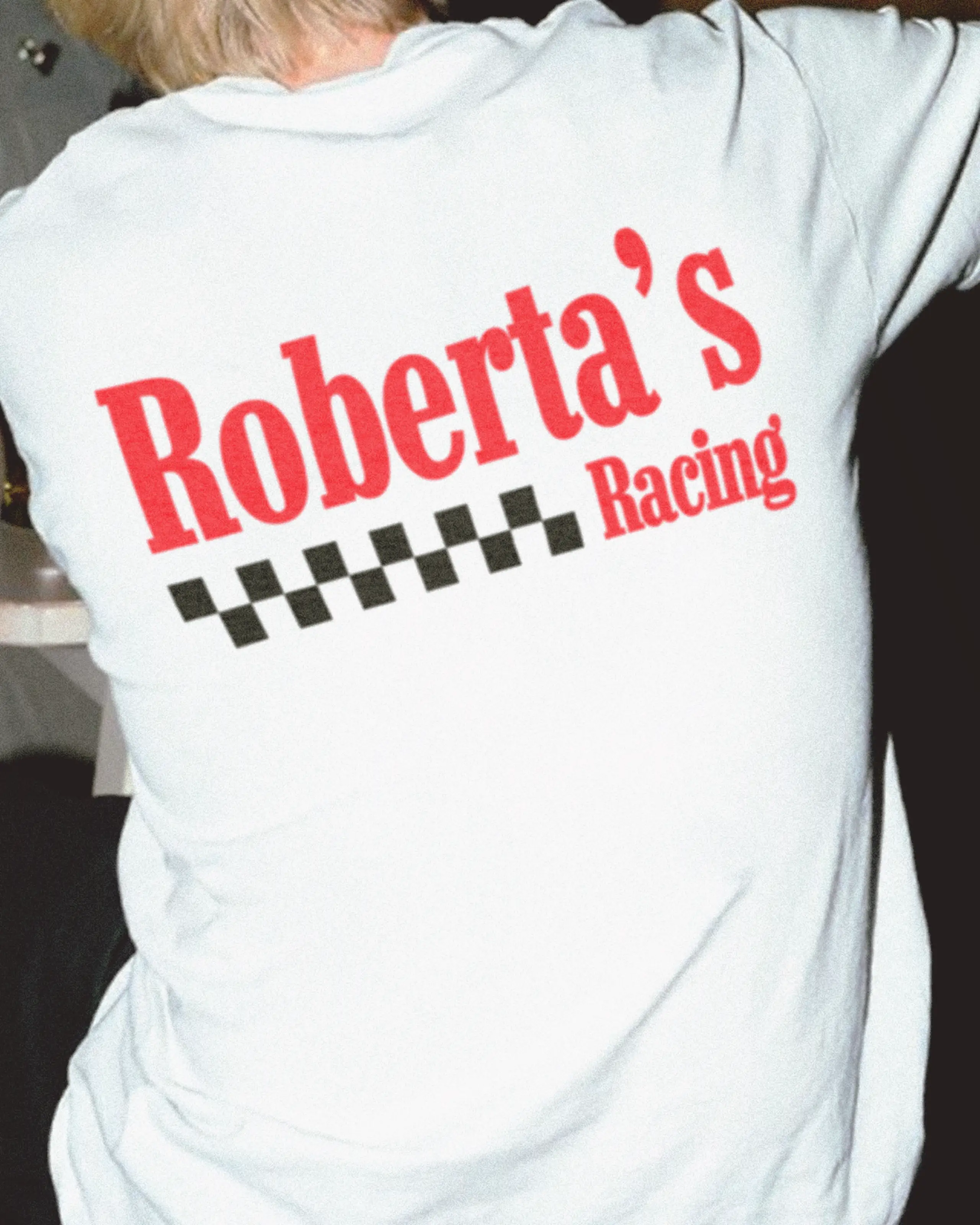 Roberta's racing design on the back of a white tee shirt